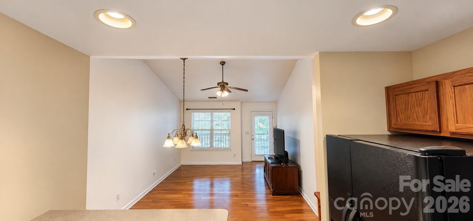 Dining Rm / Living Room with Entrance to Private Balcony - 6552 Quarterbridge Lane, Charlotte