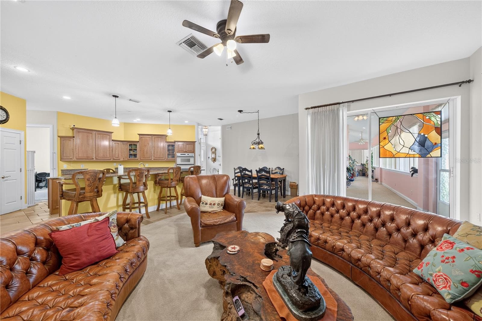 Kitchen has bar seating and ample room for casual dining. - 2335 FOREST CLUB DR, ORLANDO