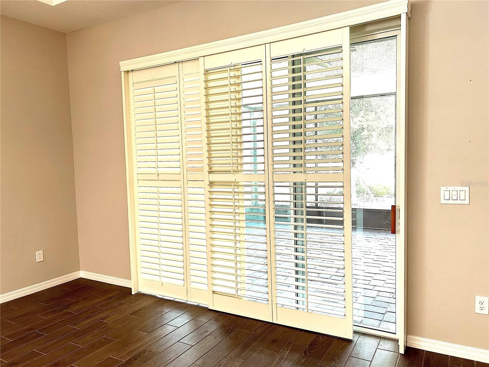 Shutter panels halfway open- slider door - 1646 KEY BAY TRL, KISSIMMEE