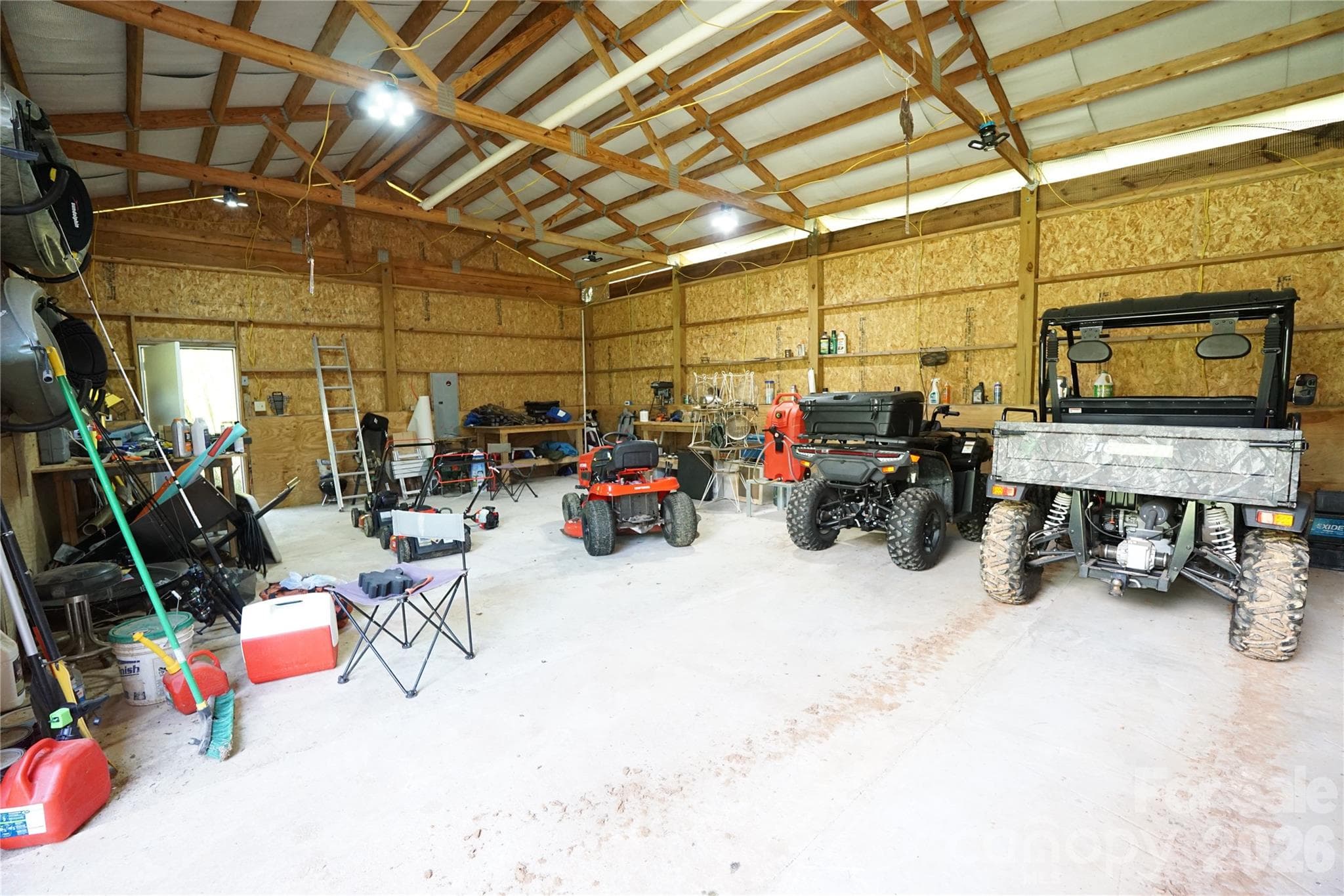 744 Square Foot workshop with cement floor, electric, and water outside door. - Mill Spring