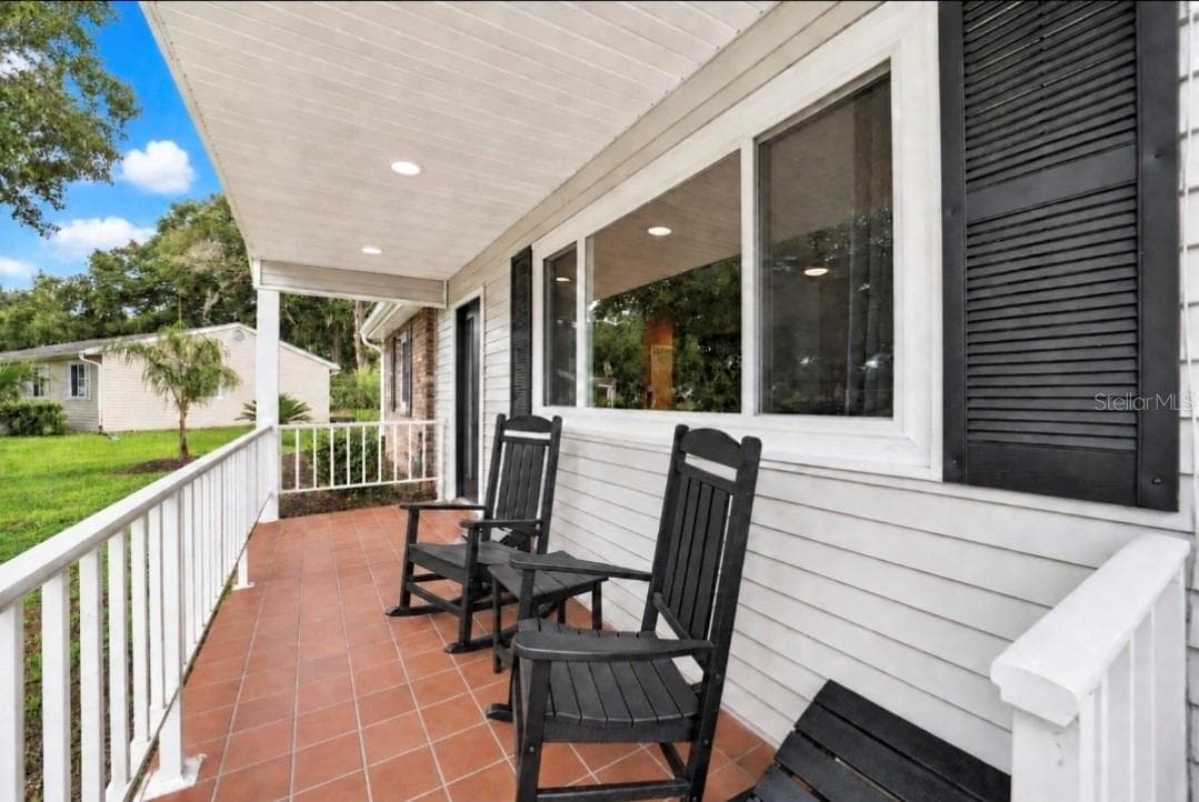 Inviting Front Porch with new windows,ceiling, LEDs and ROOF 2022 - 9282 SW 109TH LN, OCALA