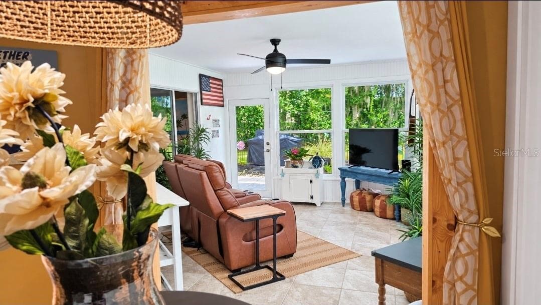 Step into your Florida room-not seperated by doors so you can use it ALL YEAR LONG. NEW HURRICANE WINDOWS : Cat 2-3. True peace of mind. - 9282 SW 109TH LN, OCALA