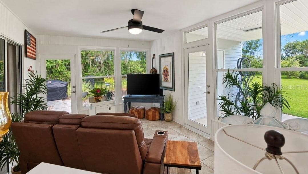 Look at those NEW Hurricane Windows- all that natural light. Its all done-you dont have to do anything but move it and start living the luxury life in the Most Affordable Resort Style Living Community. - 9282 SW 109TH LN, OCALA