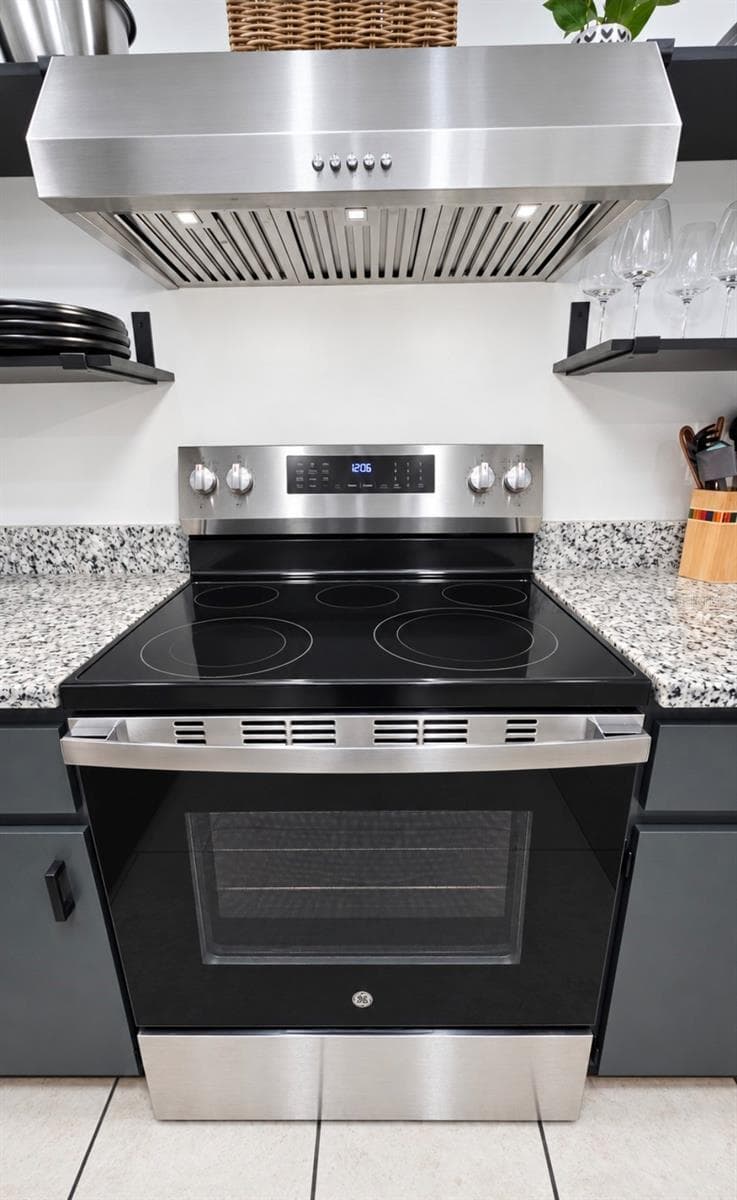 Enjoy cooking on glass top stove and upgraded hood with Bright LED lights - 9282 SW 109TH LN, OCALA