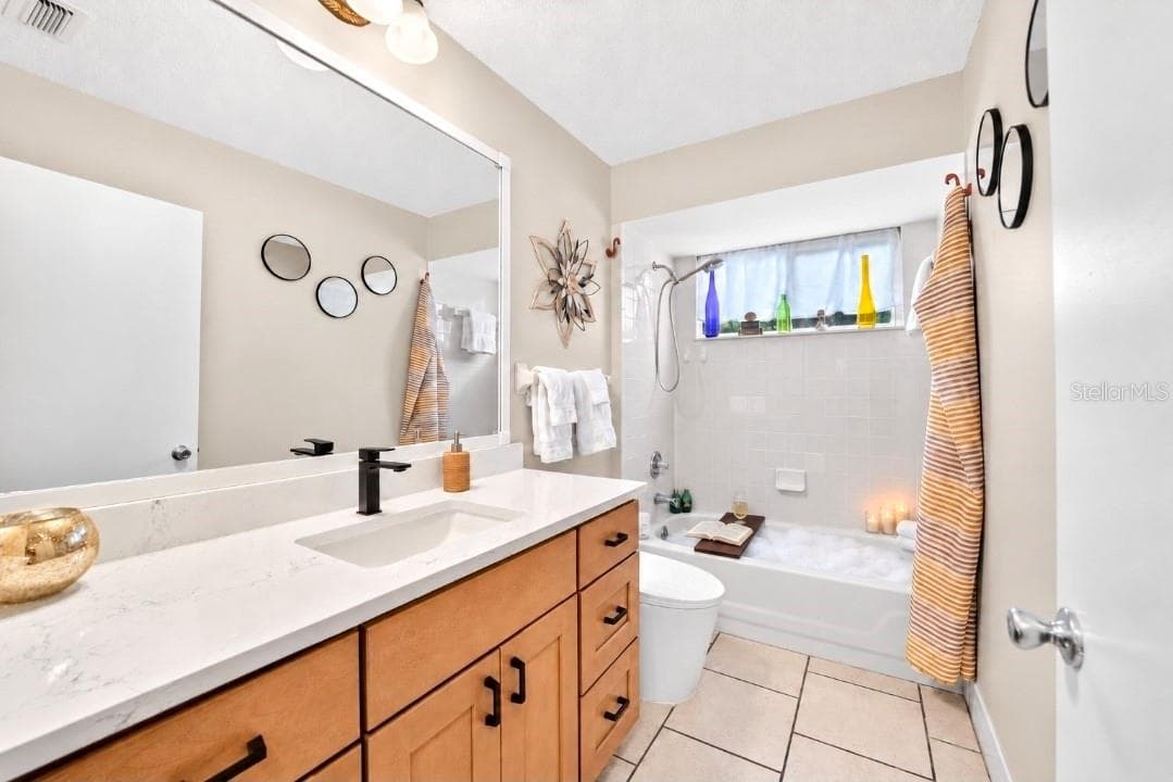 Guest Bath with QUARTZ, new ergo vanity, faucet, lights - 9282 SW 109TH LN, OCALA
