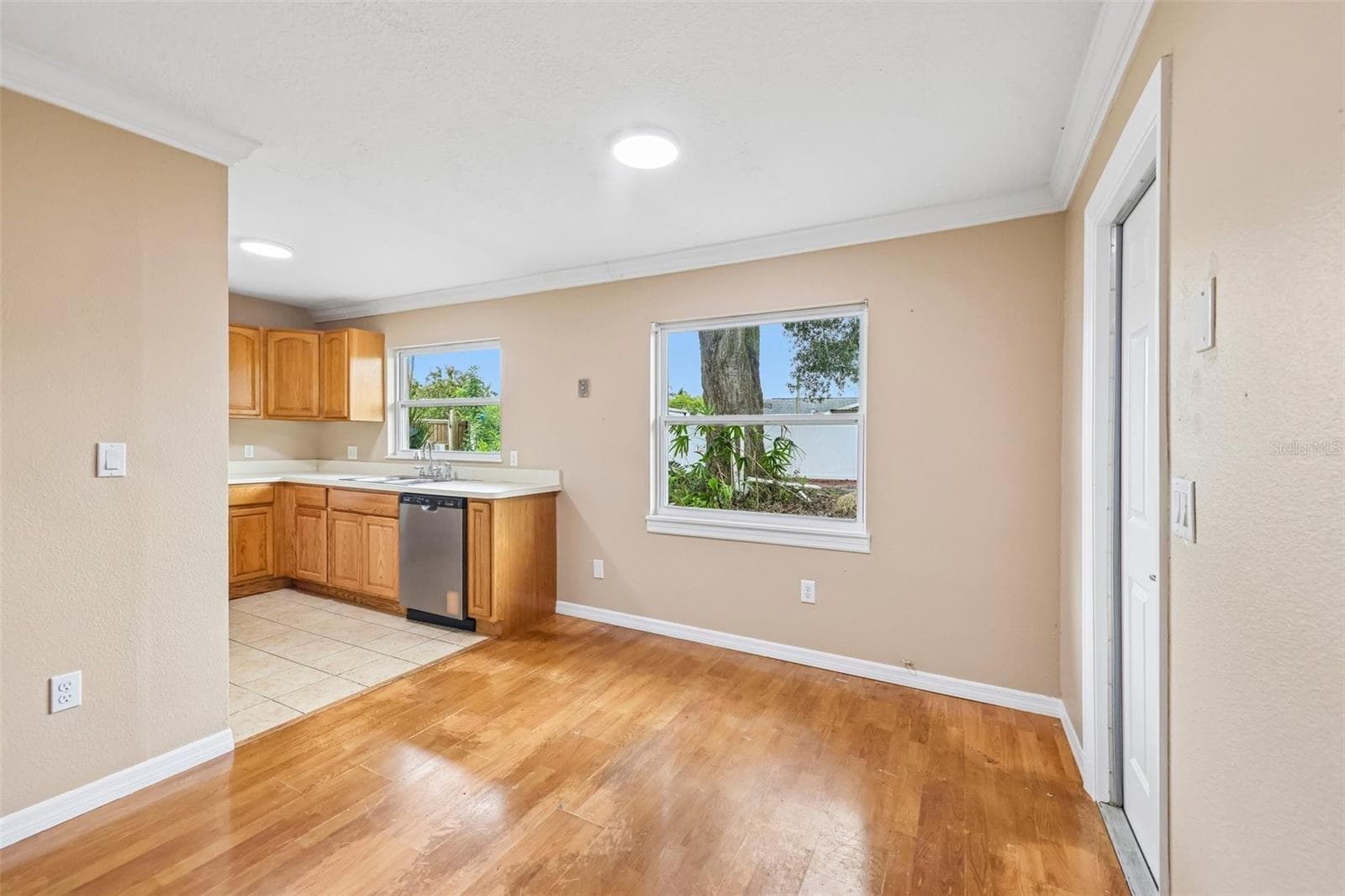 Dining area flows into the kitchen. - 6698 RIVO ALTO AVE, ORLANDO
