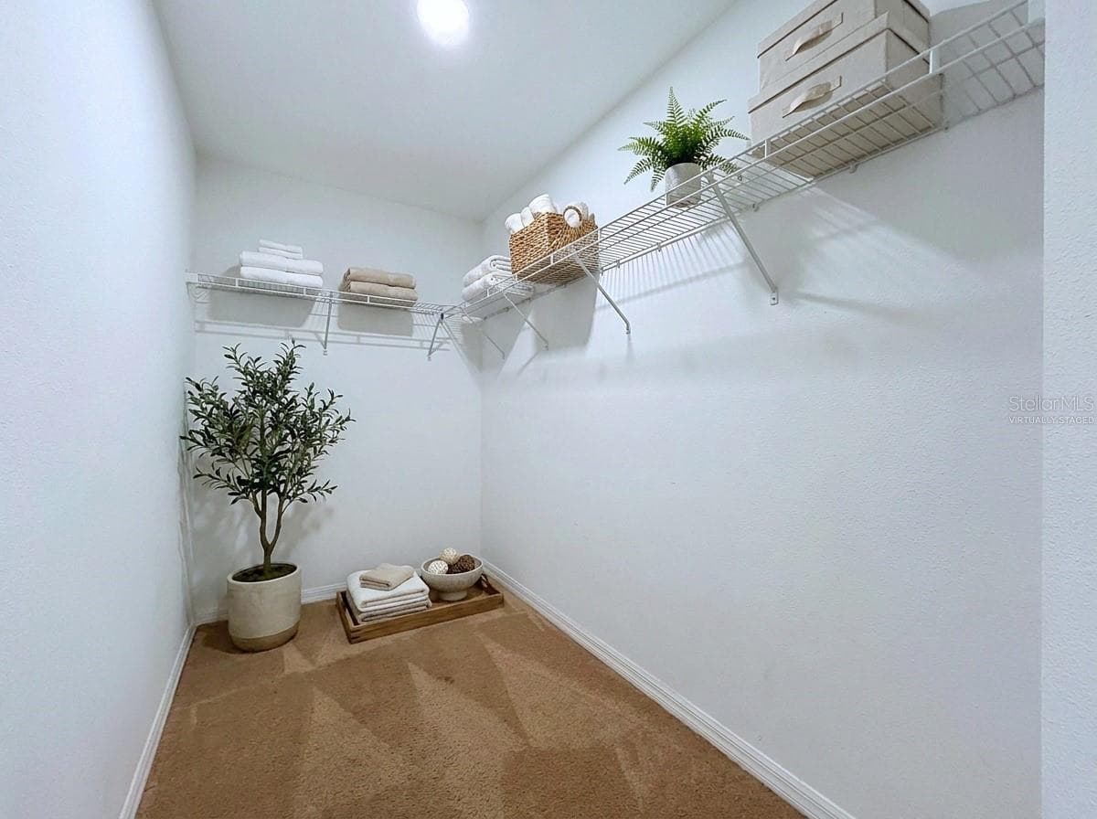Virtually staged- Master closet - 18607 BRIAR OAKS DR, HUDSON