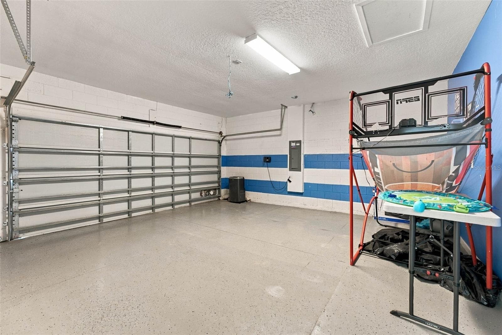 2 car garage which is used for gaming area. - 337 MARCELLO BLVD, KISSIMMEE