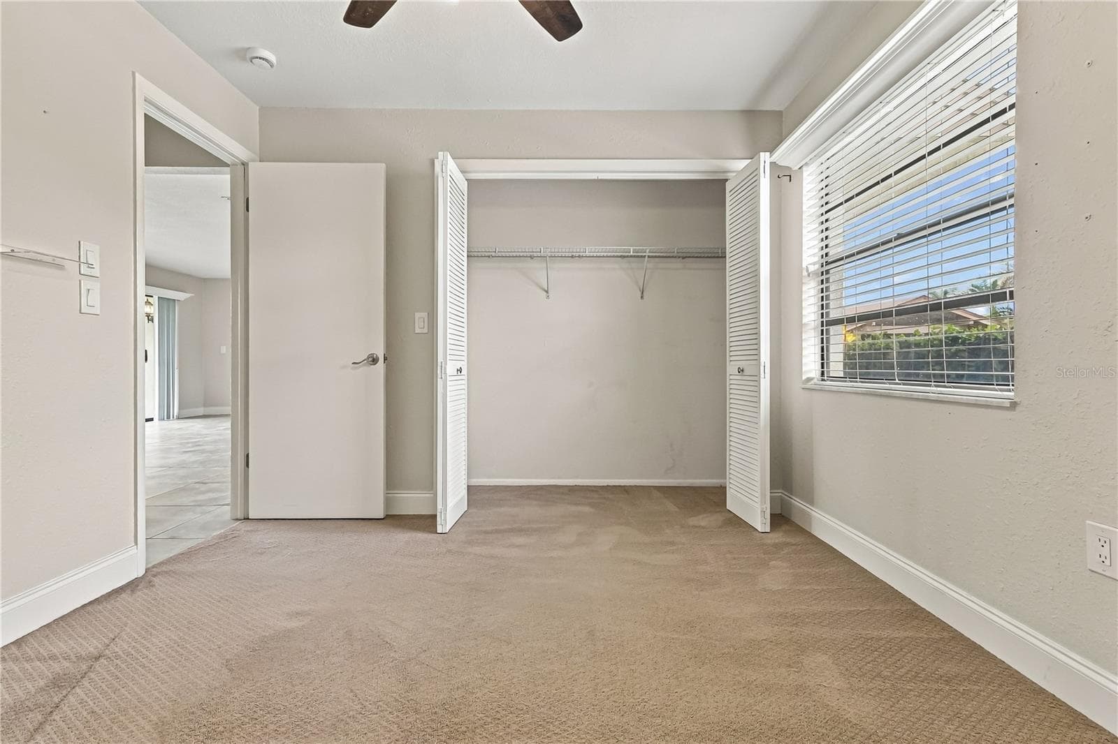 3rd room with doors leading to patio - 260 MICHAELS CIR, OLDSMAR