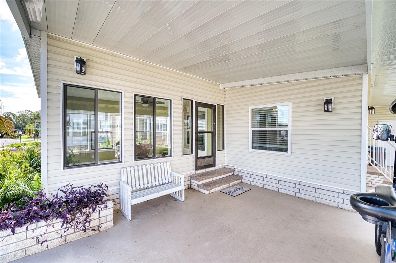 Front covered porch leading to Florida Room - 110 TOBAGO WAY, NORTH PORT