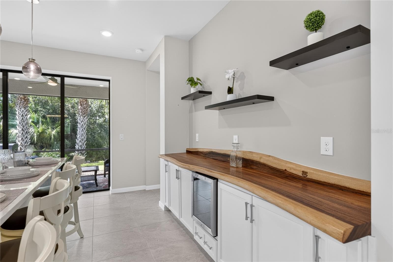 Kitchen w/wine Fridge and live edge counter - 2539 BRASSICA DR, NORTH PORT