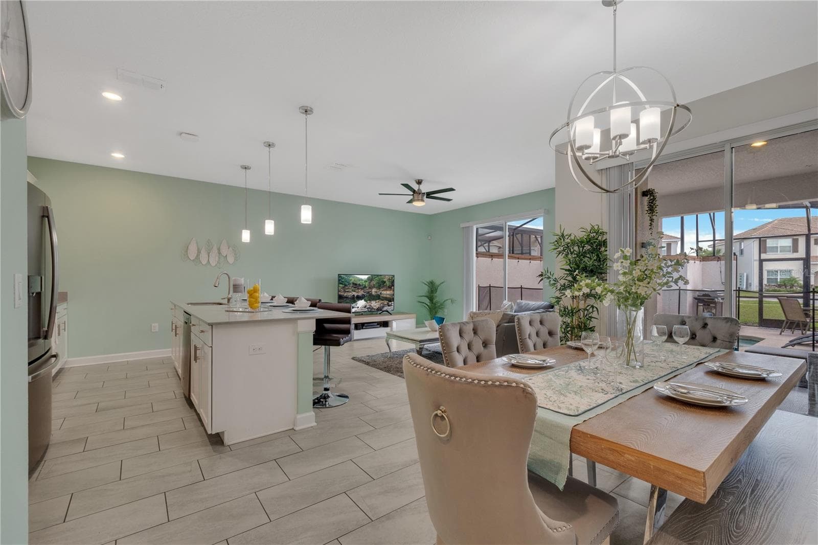 Open view of Dining Room and Kitchen - 1557 SANDBAGGER DR, DAVENPORT