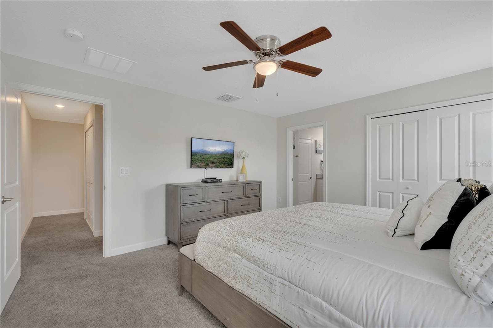 Master Bedroom showing access to Master Bathroom - 1557 SANDBAGGER DR, DAVENPORT