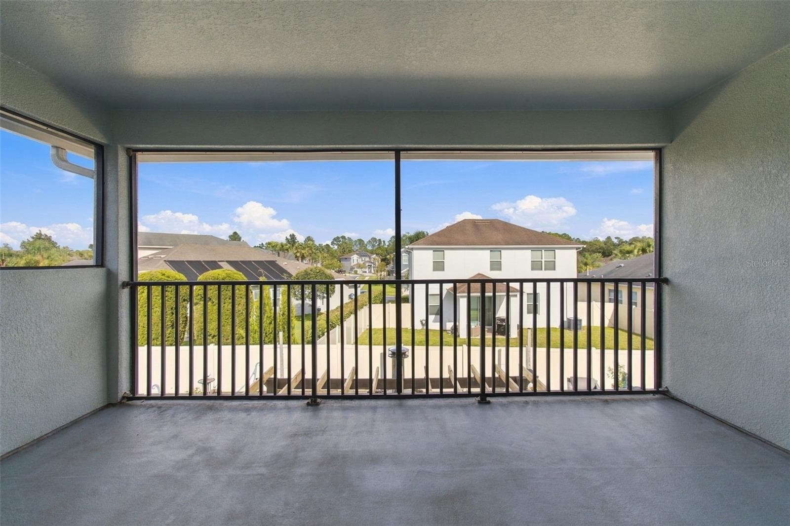 Covered and Screened Balcony from the Bonus Room - 3335 STONEGATE FALLS DR, LAND O LAKES