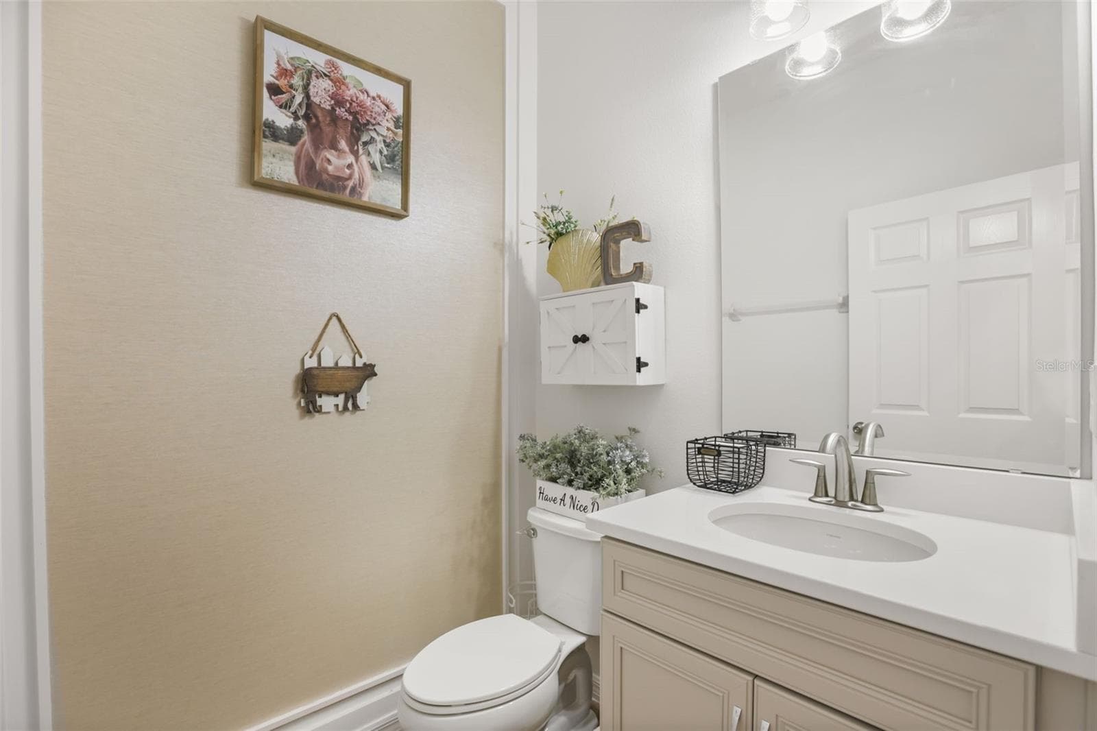 Convenient half bath with a bright vanity area. - 7104 DILLY LAKE AVE, GROVELAND