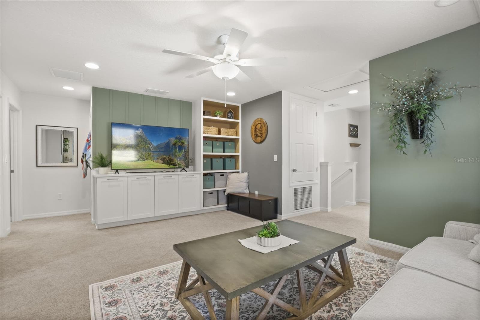 Spacious upstairs loft with built-in cabinetry, perfect for a second living area or media room - 7104 DILLY LAKE AVE, GROVELAND