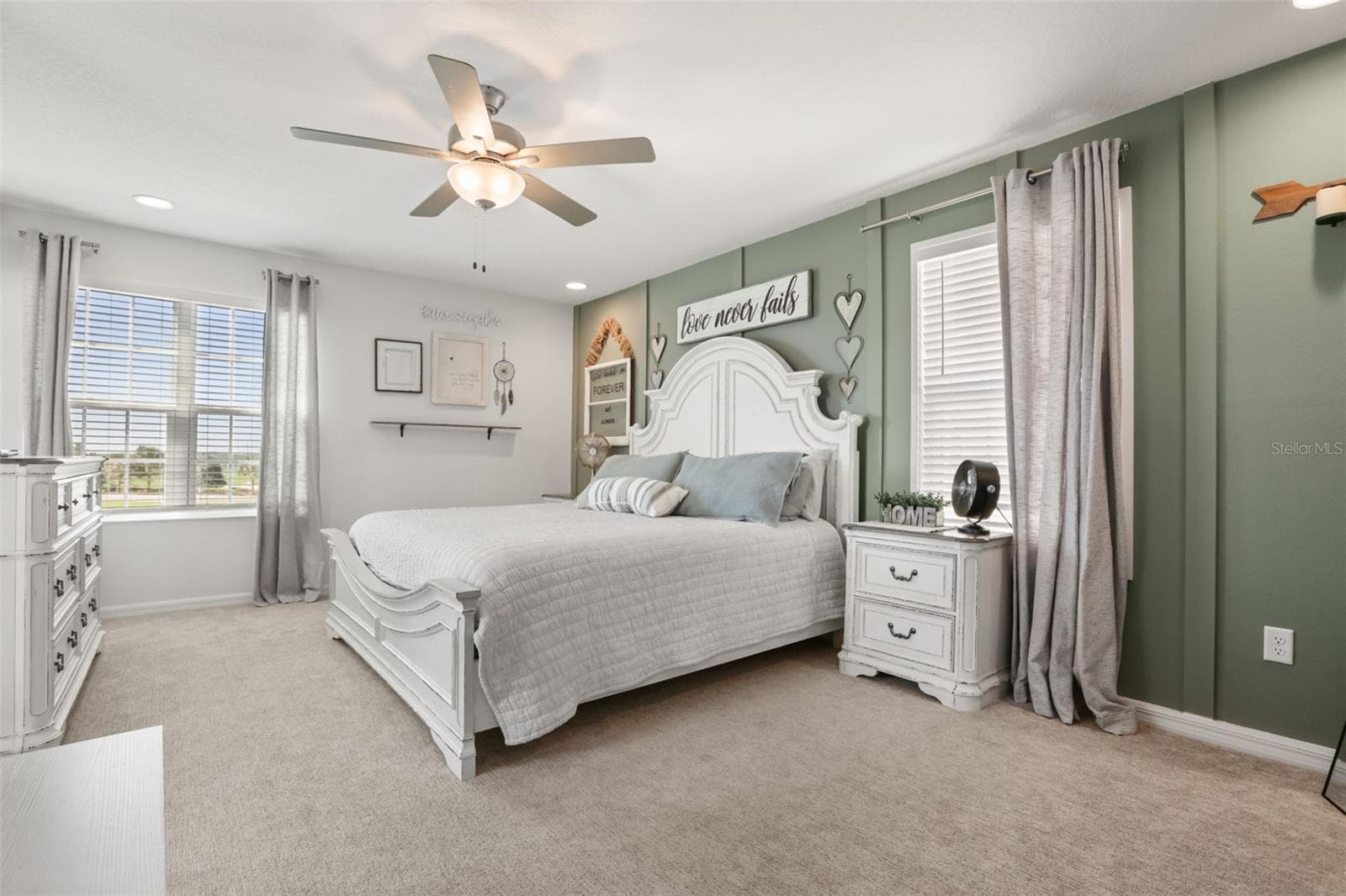 Spacious primary bedroom with plenty of natural light and generous space. - 7104 DILLY LAKE AVE, GROVELAND