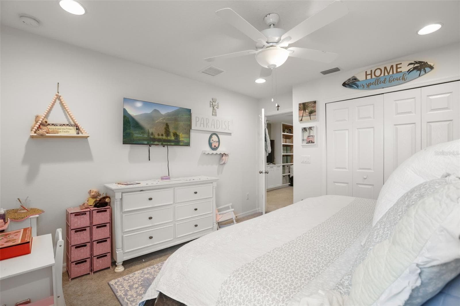 Another view of the secondary bedroom, showing the built-in closet and flexible layout. - 7104 DILLY LAKE AVE, GROVELAND