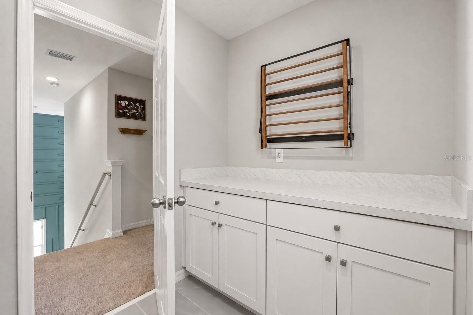 Another view of the laundry room with built-in cabinetry and additional counter space. - 7104 DILLY LAKE AVE, GROVELAND