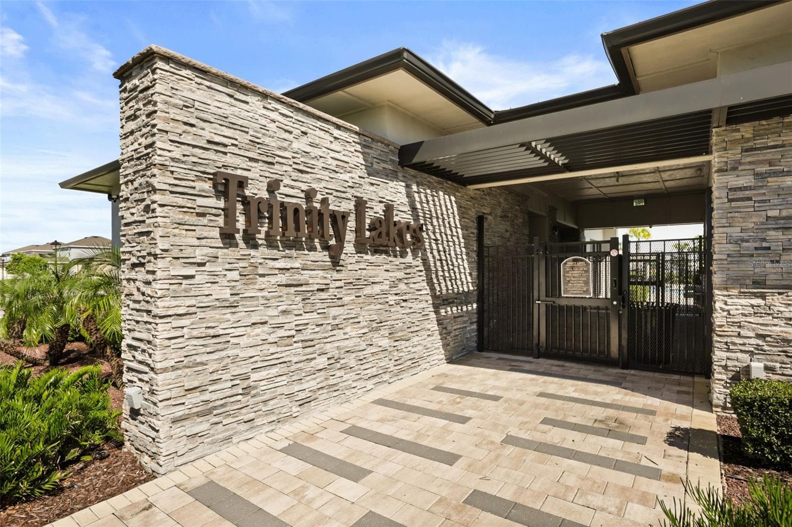 Entrance to the Trinity Lakes community clubhouse and amenity center. - 7104 DILLY LAKE AVE, GROVELAND