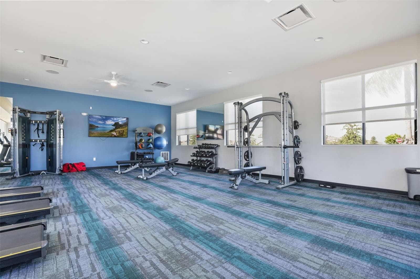 Trinity Lakes fitness center with cardio equipment, weights, and plenty of workout space. - 7104 DILLY LAKE AVE, GROVELAND