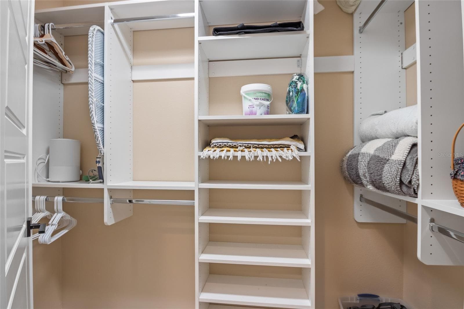 Custom shelving in his and her closets. - 4529 SAMANTHA CT, THE VILLAGES