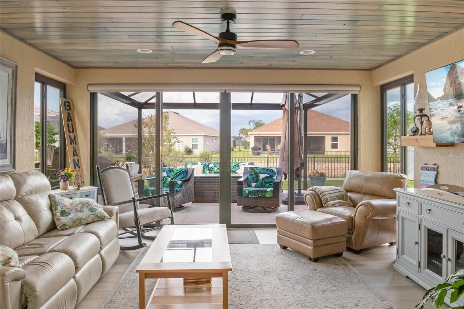 Spacious Florida room with LVP flooring, remote control shades. - 4529 SAMANTHA CT, THE VILLAGES