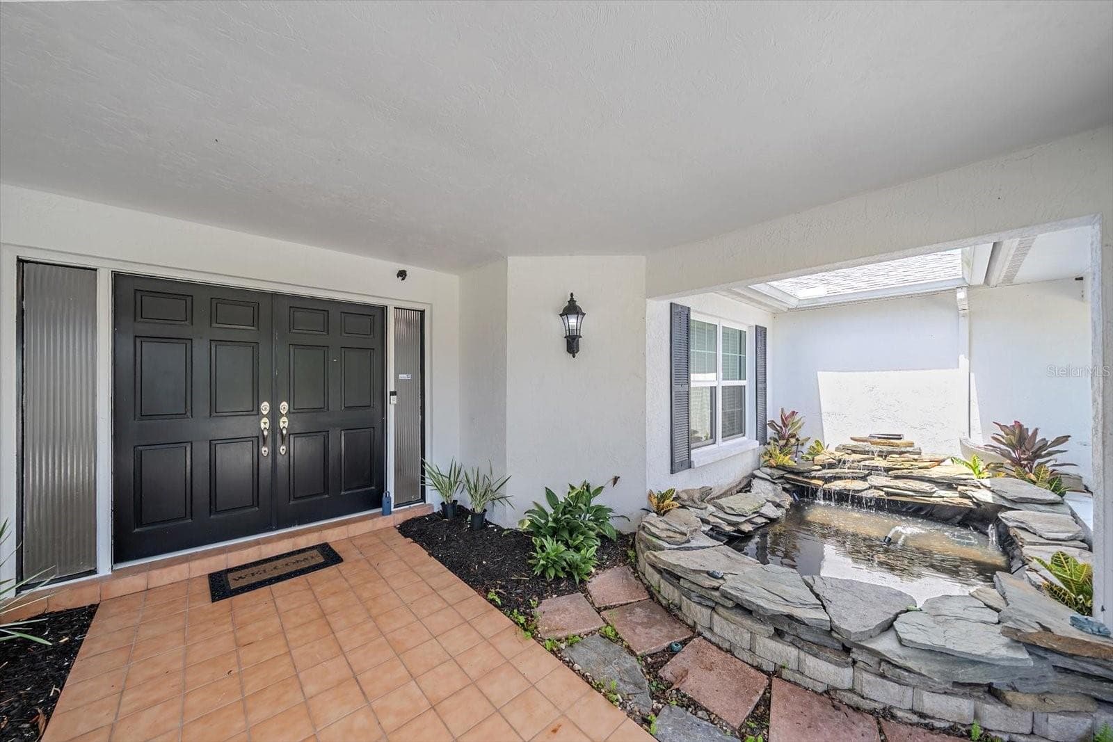Relaxing Pond and waterfall at the entrance! - 6840 COUNTRY LAKES CIR, SARASOTA
