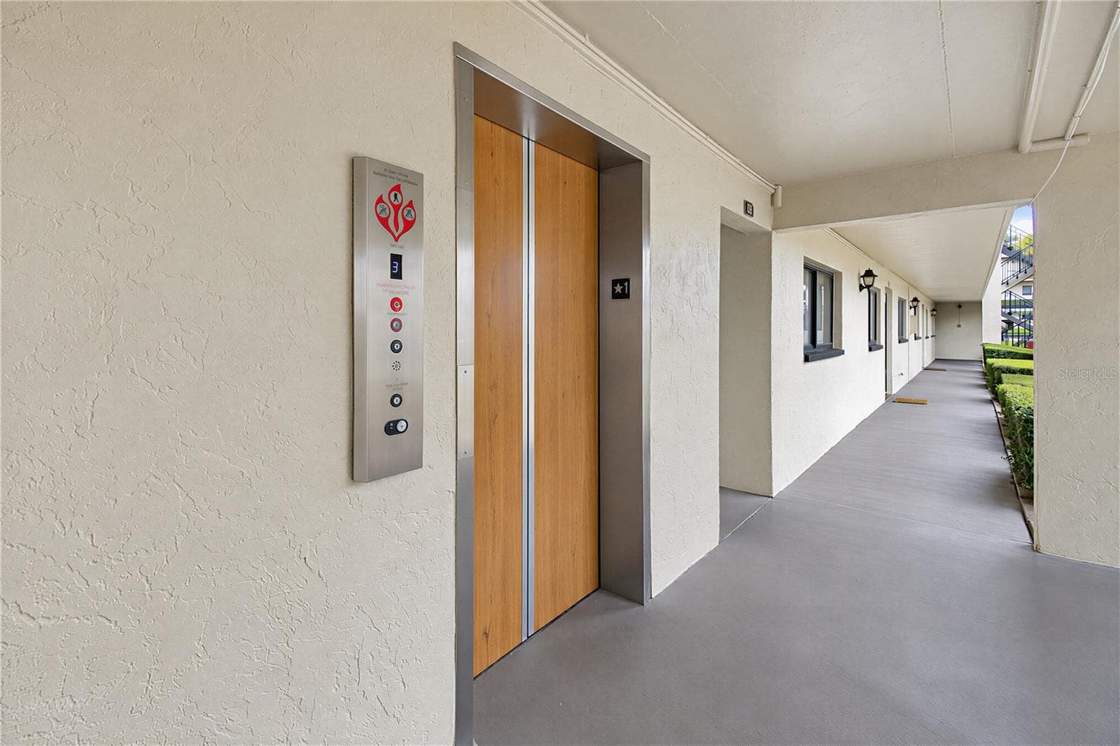 Convenient elevator access to the third floor. - 2440 WINDING CREEK BLVD #307, CLEARWATER