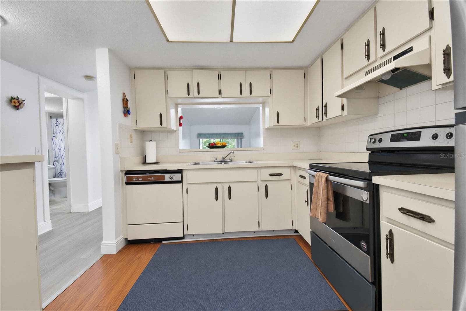 Additional view of the kitchen with appliances included. - 2440 WINDING CREEK BLVD #307, CLEARWATER