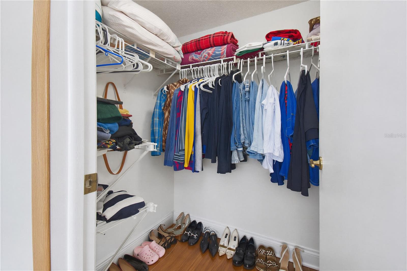 Bedroom closet with ample storage space. - 2440 WINDING CREEK BLVD #307, CLEARWATER