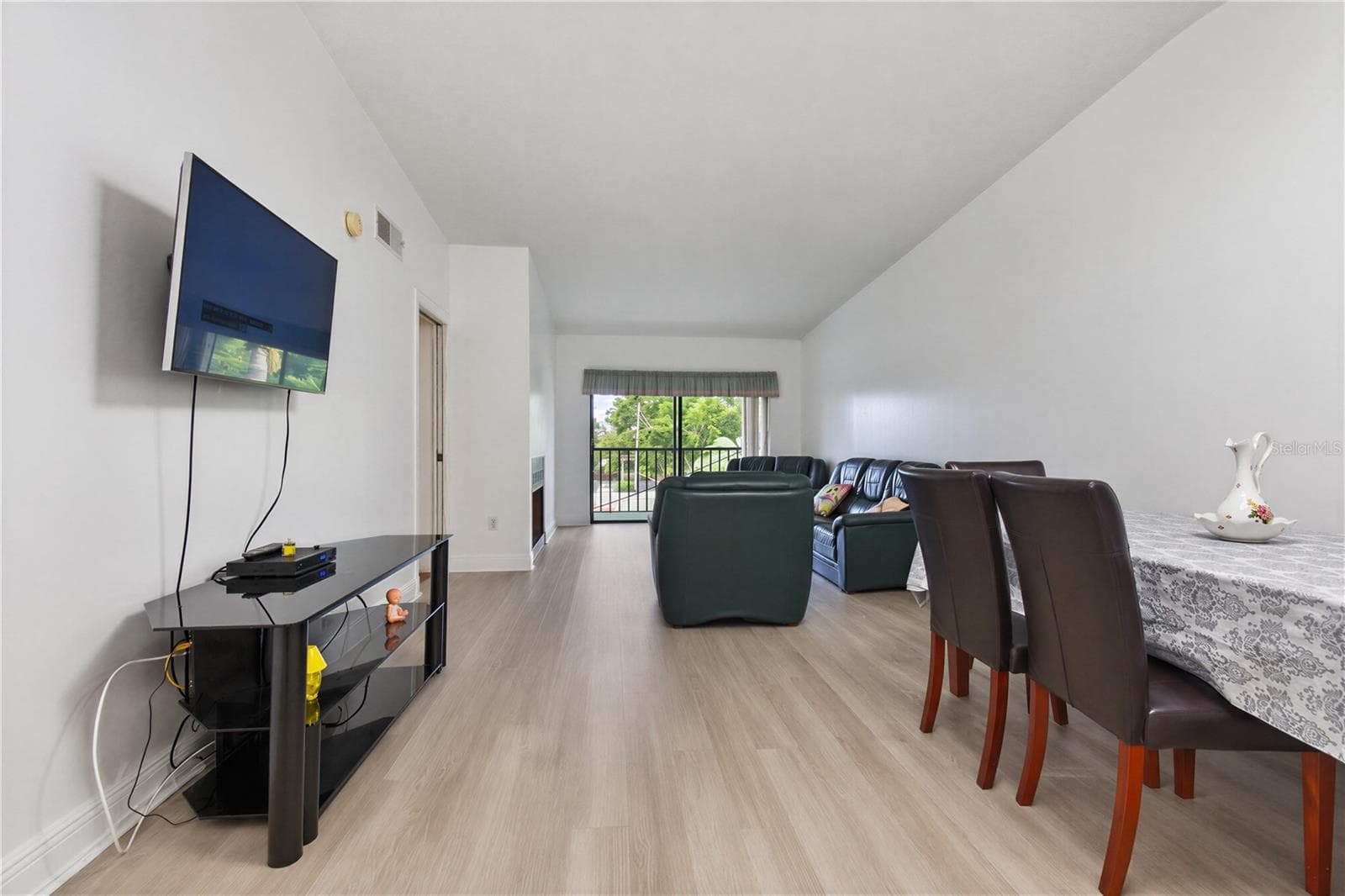 Additional view of the living and dining area. - 2440 WINDING CREEK BLVD #307, CLEARWATER