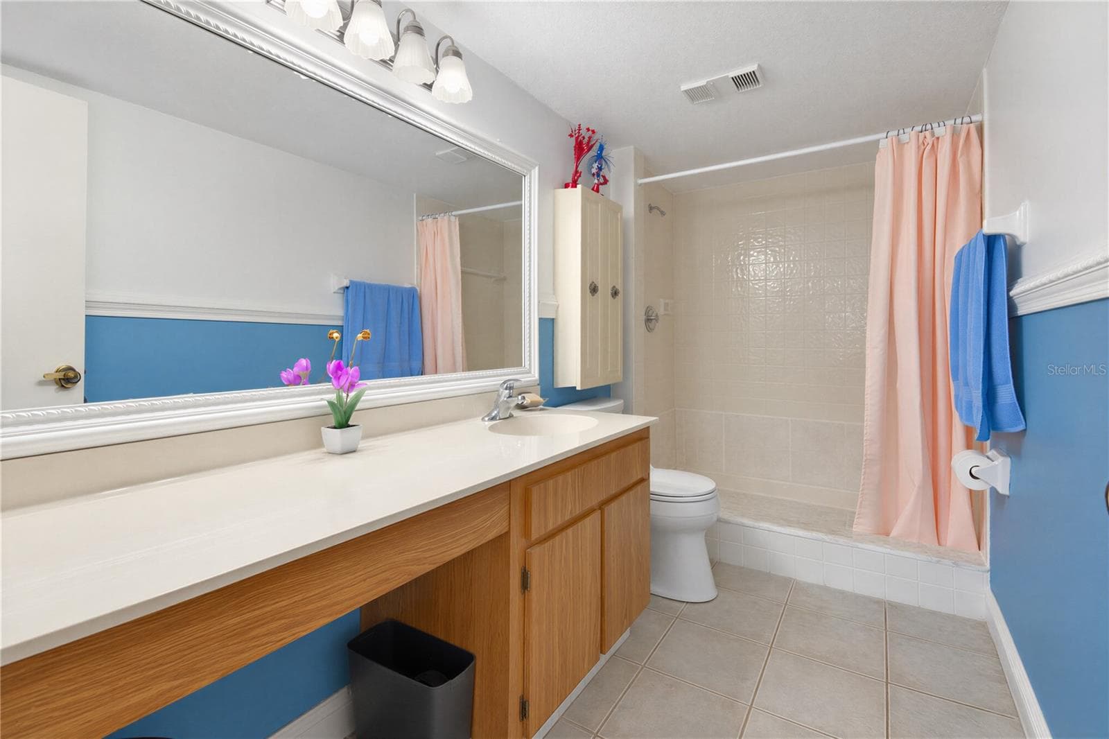 Primary bathroom with extended vanity and ample counter space. - 2440 WINDING CREEK BLVD #307, CLEARWATER