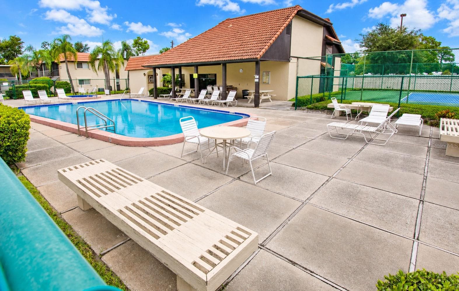 Community swimming pool and recreational area. - 2440 WINDING CREEK BLVD #307, CLEARWATER