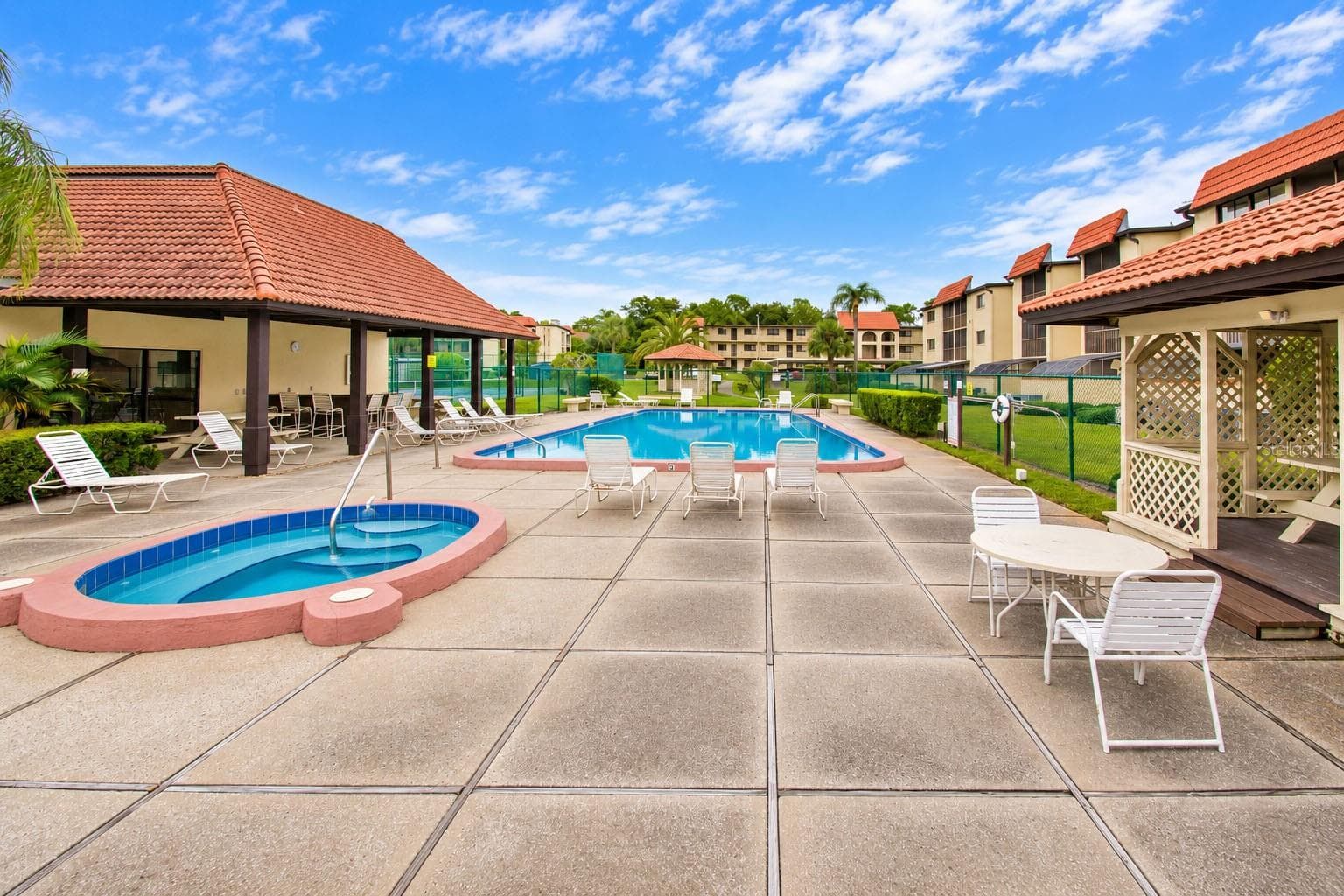 Community spa and pool area. - 2440 WINDING CREEK BLVD #307, CLEARWATER