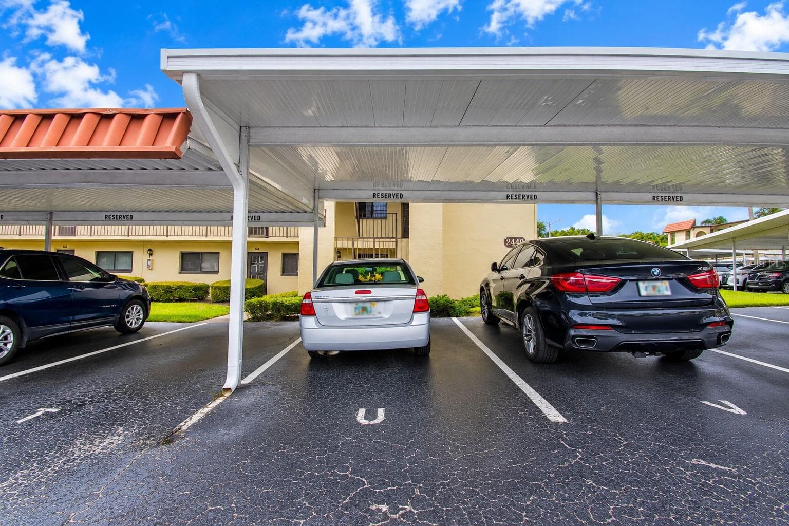 Convenient covered community parking. - 2440 WINDING CREEK BLVD #307, CLEARWATER