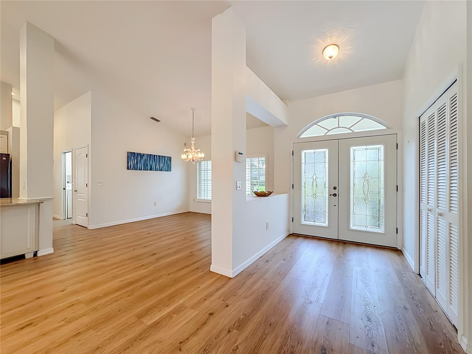 Beautiful luxury flooring ,13 foot ceilings in the living room.Bright and filled with sunshine. - 4415 HIGHLAND OAKS CIR, SARASOTA