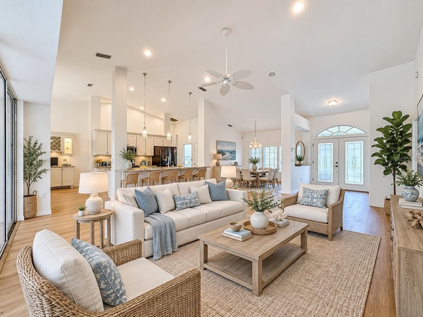 Living space with views of the outdoor pool and golf course. - 4415 HIGHLAND OAKS CIR, SARASOTA