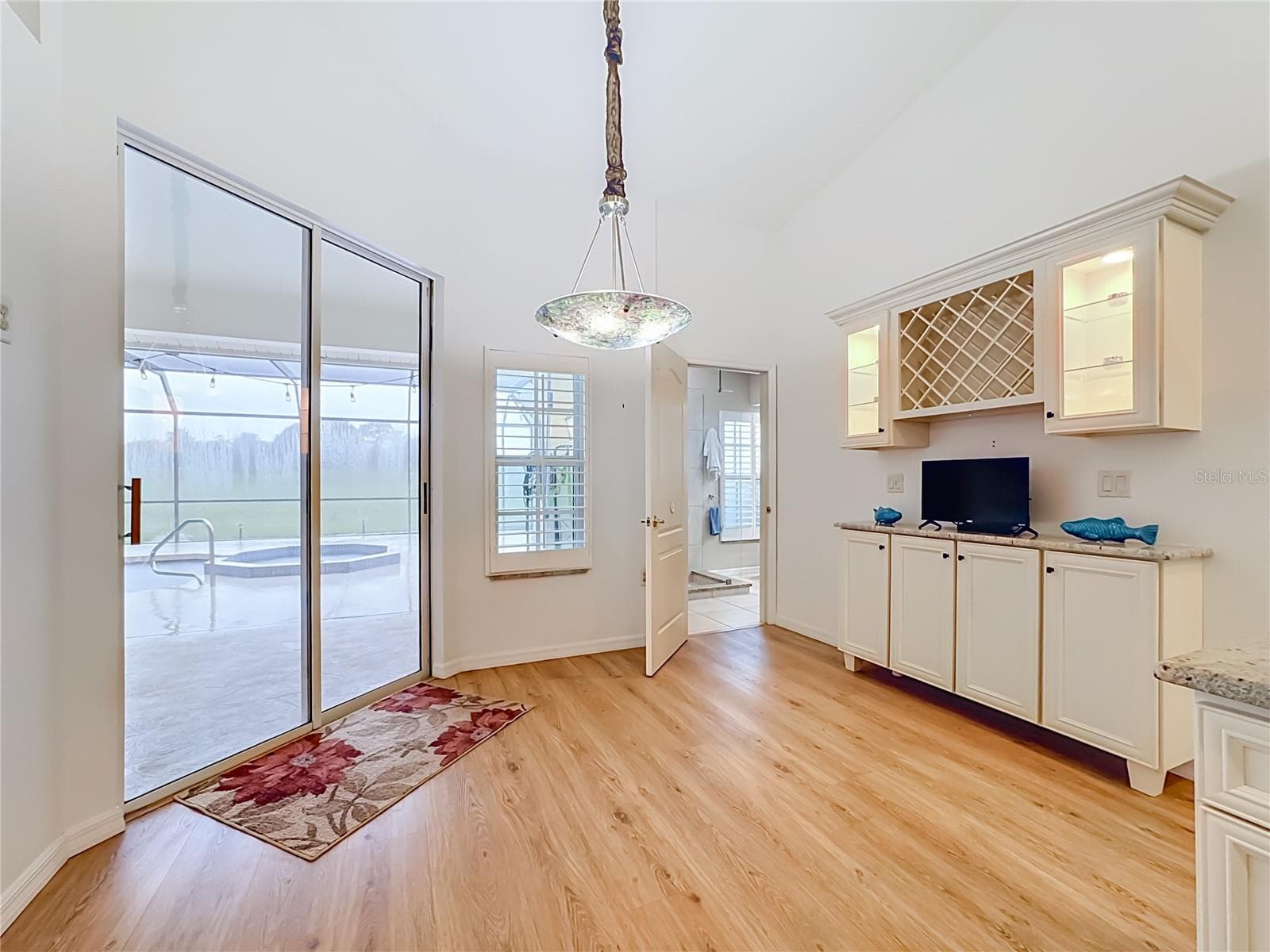 Built in wine cabient storage with lite glass cabients. - 4415 HIGHLAND OAKS CIR, SARASOTA