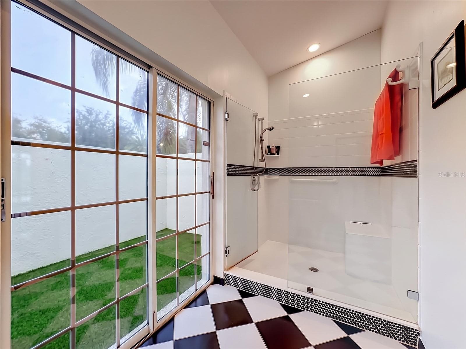 Double sliding doors leading to outdoor enclosed area. - 4415 HIGHLAND OAKS CIR, SARASOTA