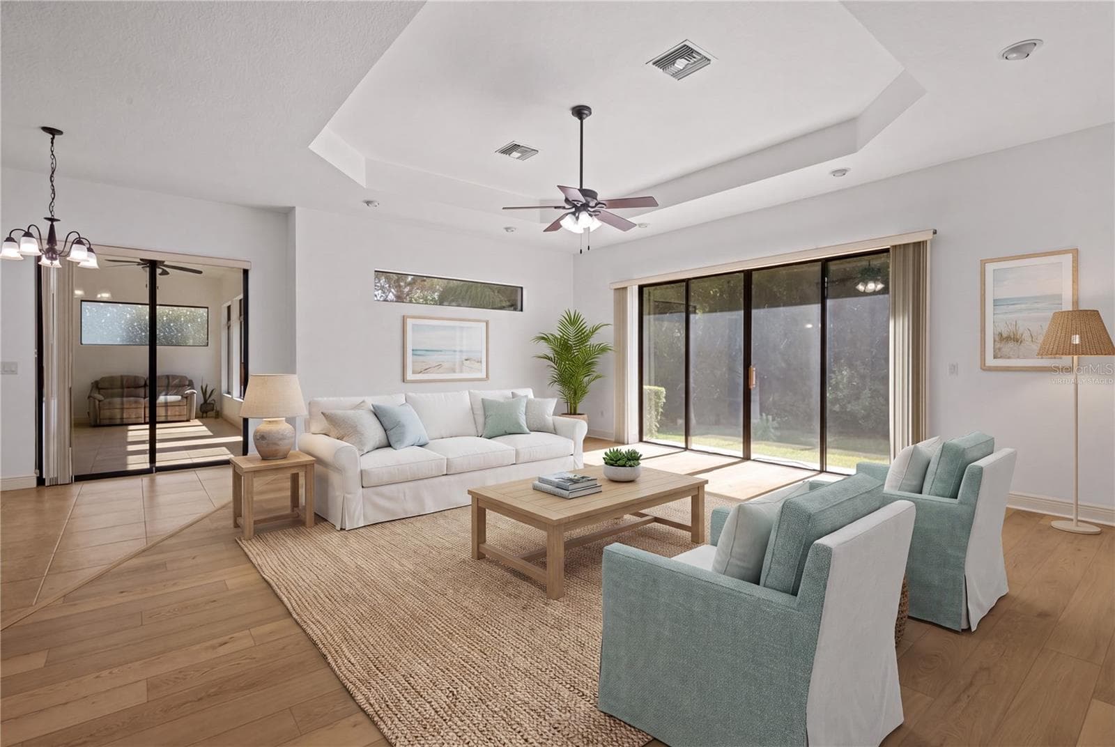 The family room is highlighted by an impressive 9-by-12-foot window framing protected conservation views. - virtually staged - 14834 MAN O WAR DR, ODESSA