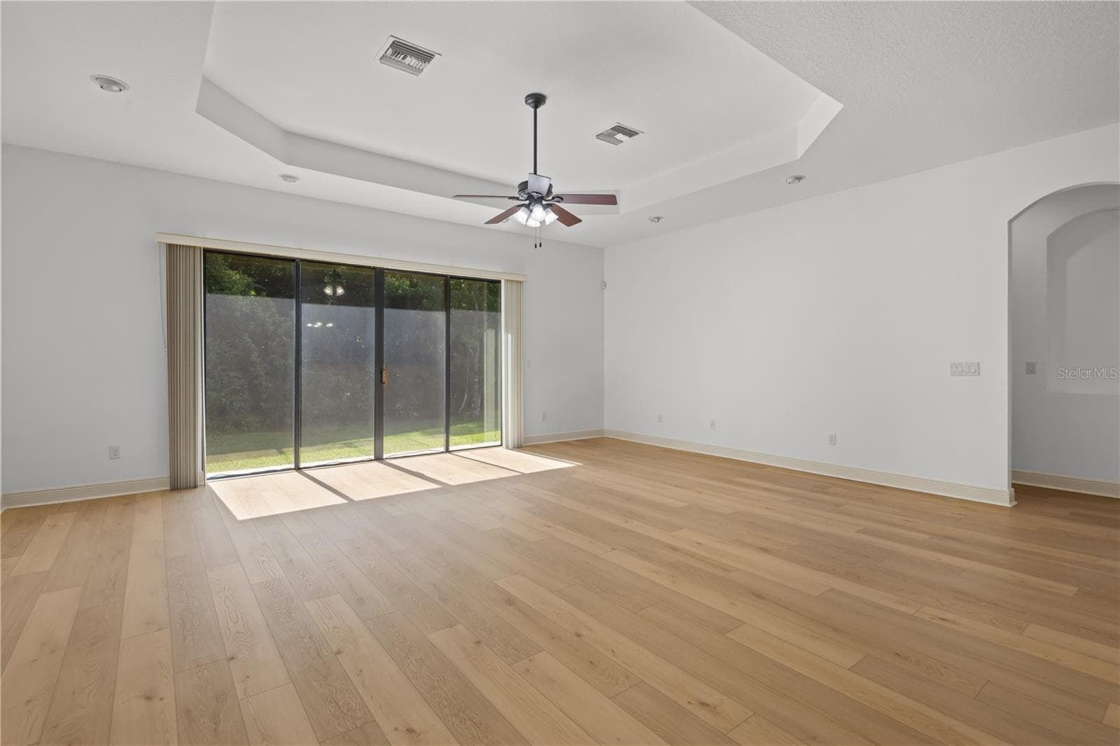 The family room is highlighted by an impressive 9-by-12-foot window framing protected conservation views. - 14834 MAN O WAR DR, ODESSA
