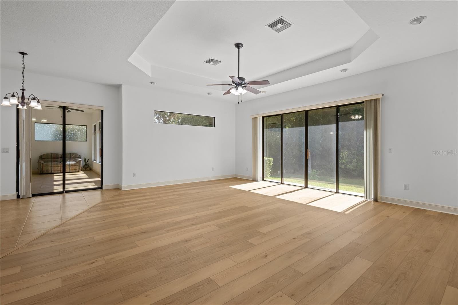 The family room is highlighted by an impressive 9-by-12-foot window framing protected conservation views. - 14834 MAN O WAR DR, ODESSA