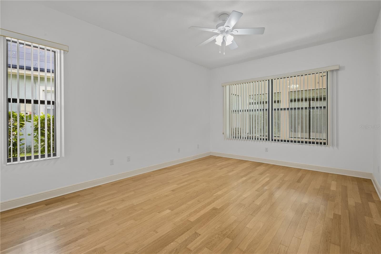 The spacious primary bedroom provides a peaceful retreat with room for a complete furniture arrangement. - 14834 MAN O WAR DR, ODESSA