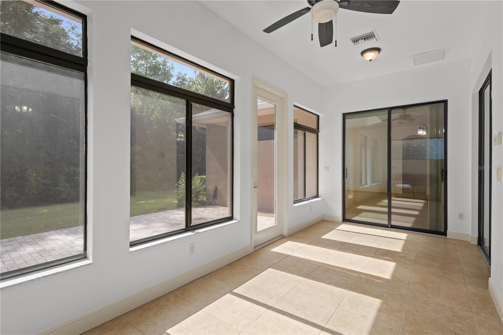 Florida room in back of home provides stunning conservation views with central AC - 14834 MAN O WAR DR, ODESSA