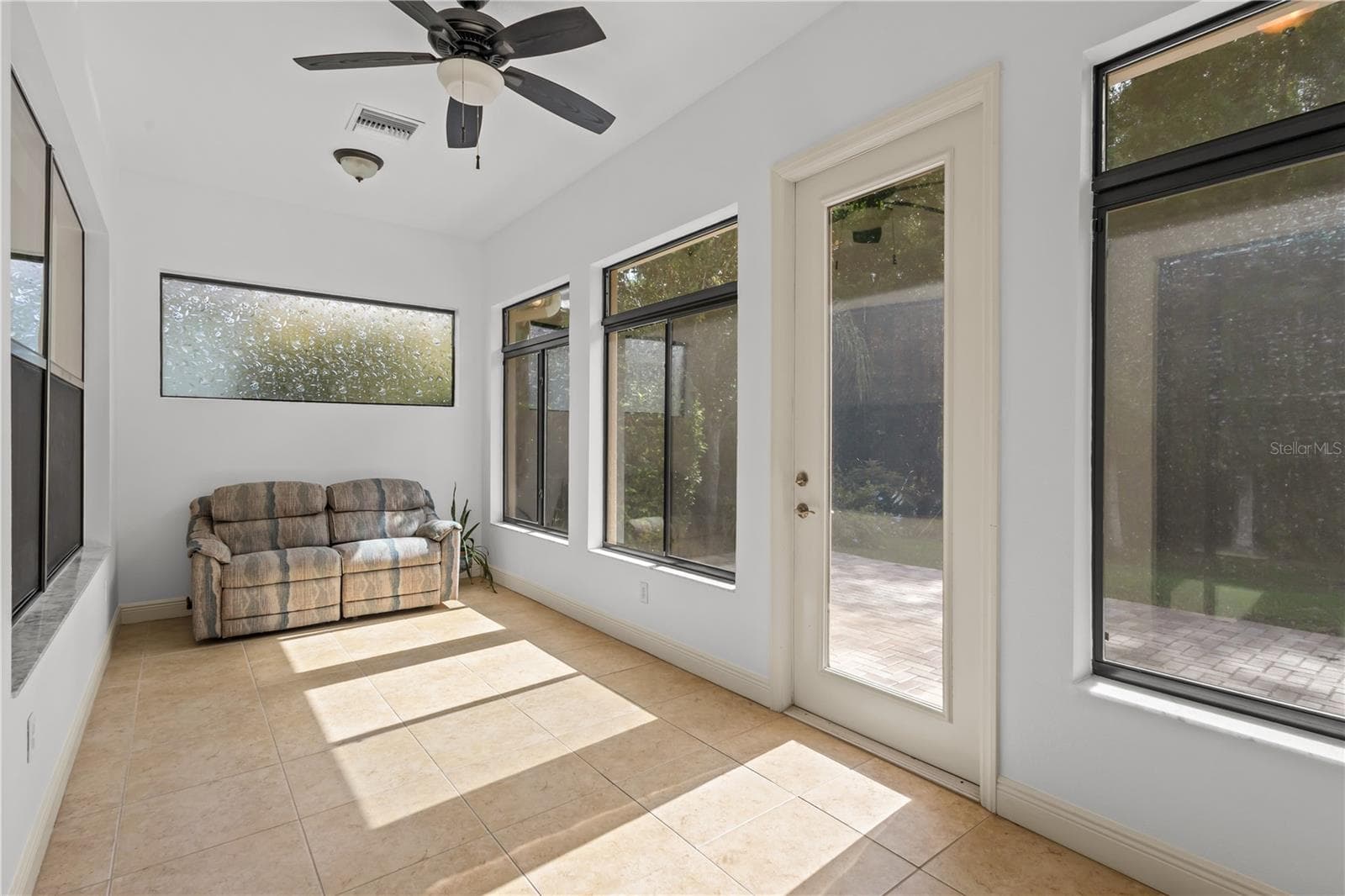Florida room in back of home provides stunning conservation views with central AC - 14834 MAN O WAR DR, ODESSA