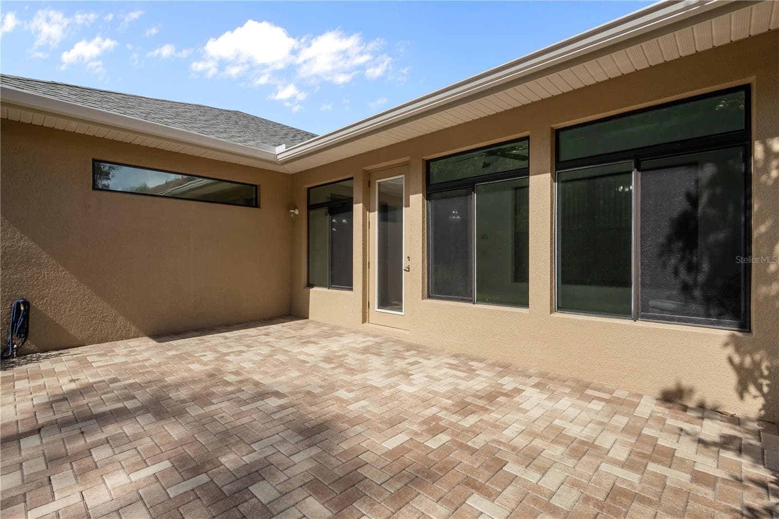 Extended paver lanai provides great space for outdoor entertainment - 14834 MAN O WAR DR, ODESSA