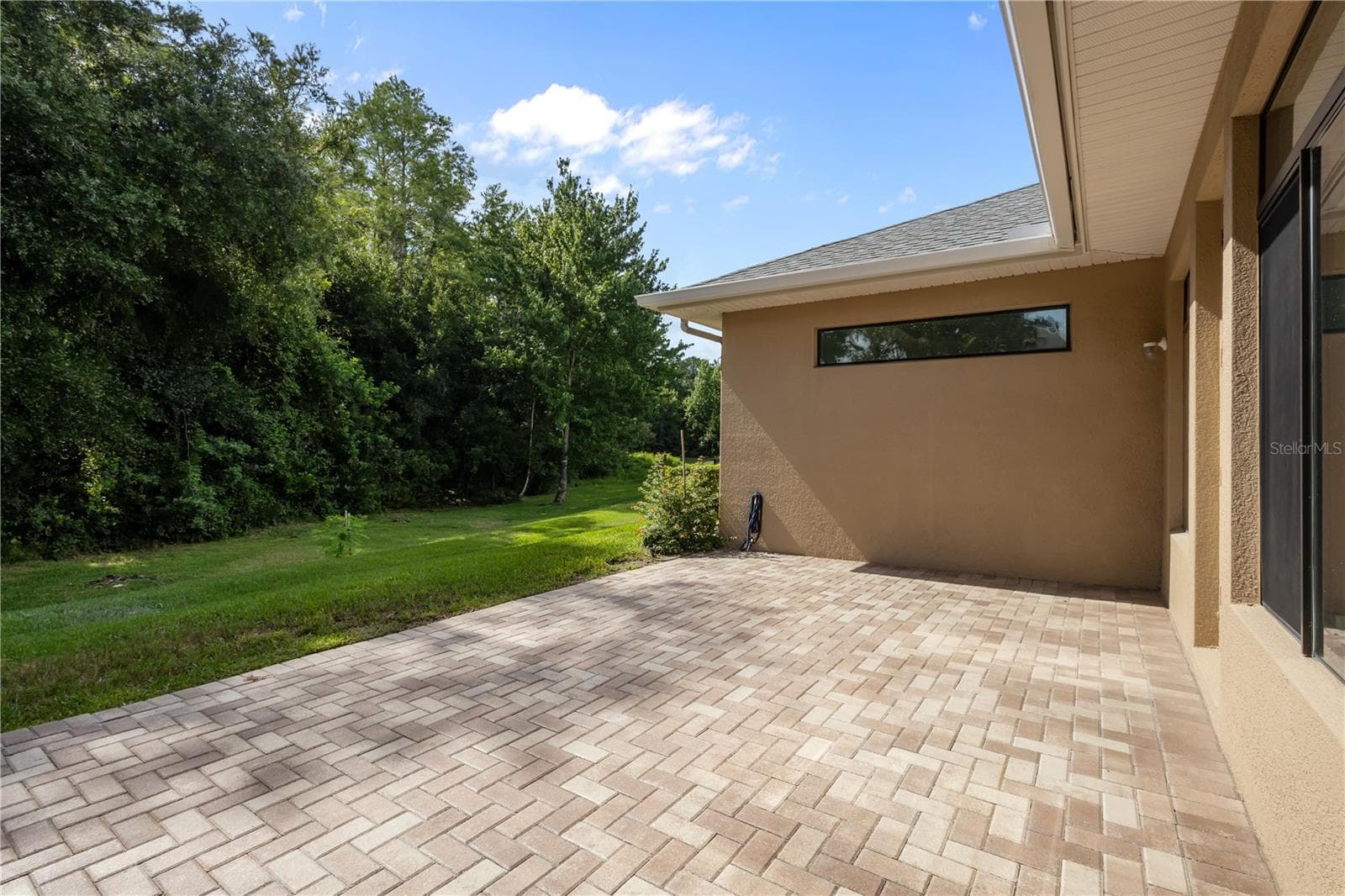 Extended paver lanai provides great space for outdoor entertainment - 14834 MAN O WAR DR, ODESSA