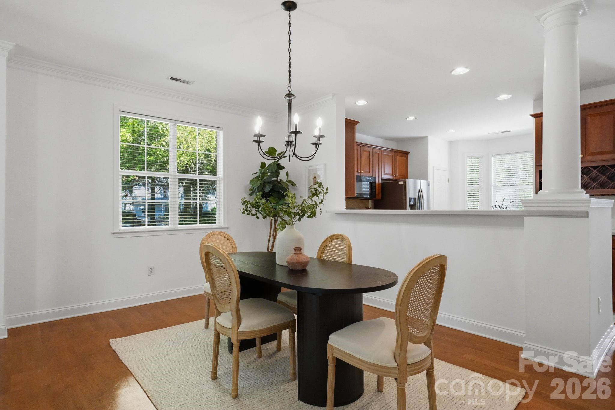 Open dining area sits between the kitchen and family room, creating a natural gathering space. - 18810 Cloverstone Circle, Cornelius