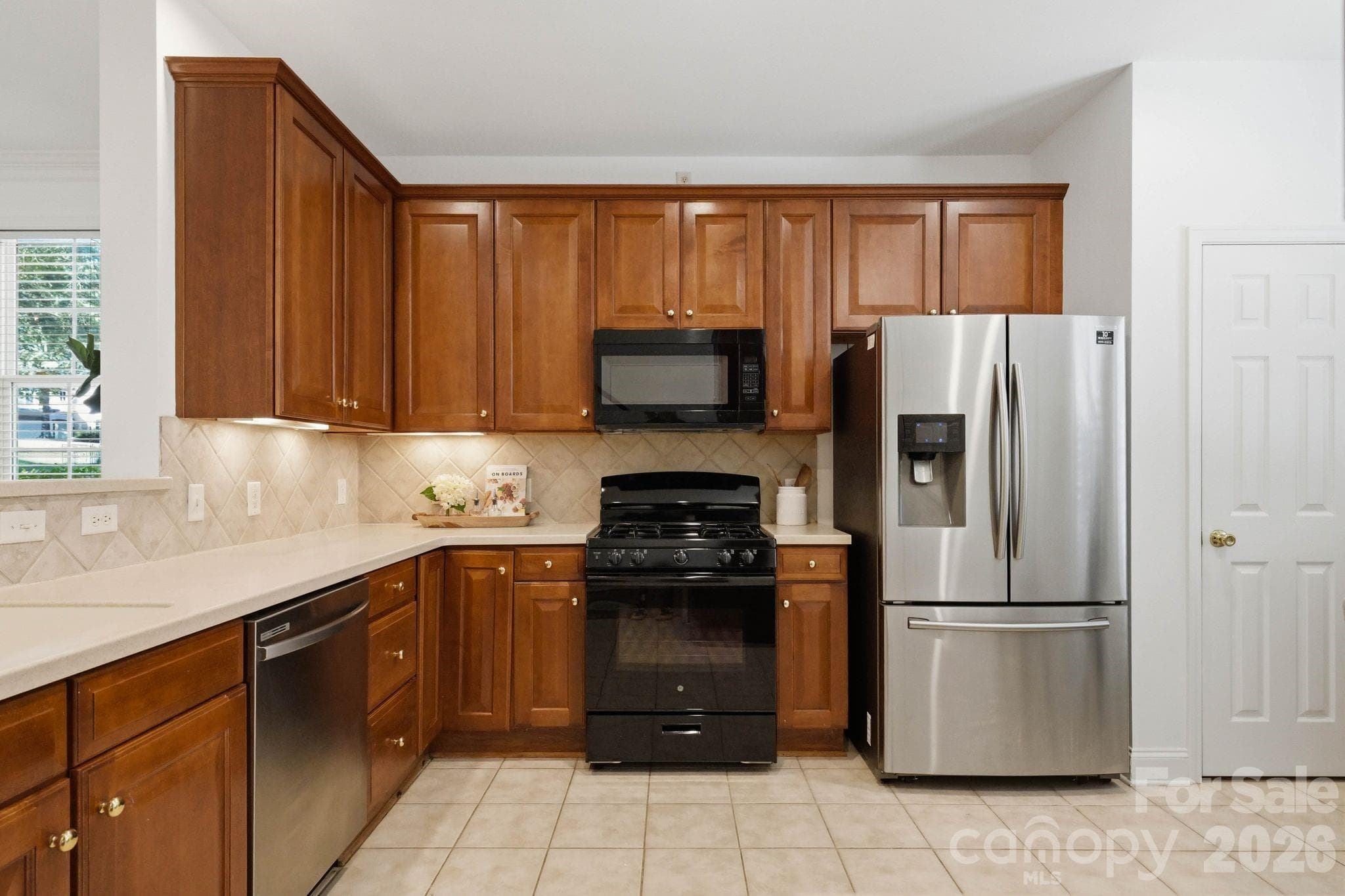 Bright kitchen with abundant cabinetry and generous storage. - 18810 Cloverstone Circle, Cornelius